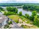 Aerial view of community amenities with river, green spaces, amphitheater, and building in the background at 790 Herrons Ferry Rd, Rock Hill, SC 29730