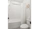 All-white bathroom with subway tile backsplash, white toilet, and window above tub at 790 Herrons Ferry Rd, Rock Hill, SC 29730