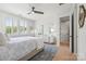Bright bedroom boasts sunny windows, blonde hardwood floors, and a decorative rug at 790 Herrons Ferry Rd, Rock Hill, SC 29730