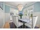 Chic dining room with statement lighting, marble table and open layout at 790 Herrons Ferry Rd, Rock Hill, SC 29730