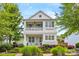 Charming two-story home with a welcoming front porch and beautifully maintained landscaping at 790 Herrons Ferry Rd, Rock Hill, SC 29730