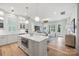 Open-concept kitchen with a center island, stainless steel oven, and seamless flow to the adjacent living area at 790 Herrons Ferry Rd, Rock Hill, SC 29730