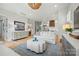 Chic living room featuring a cozy sofa, stylish coffee table, elegant furnishings, and seamless flow to the kitchen at 790 Herrons Ferry Rd, Rock Hill, SC 29730