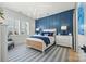 Serene main bedroom showcasing a stylish accent wall, natural light, and elegant furnishings for a relaxing retreat at 790 Herrons Ferry Rd, Rock Hill, SC 29730