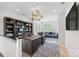 Spacious office with desk, bookcase, area rug and a comfortable seating area by the window at 790 Herrons Ferry Rd, Rock Hill, SC 29730