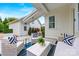 Covered patio with wicker furniture, tiled floors, and outdoor seating with a view of the yard at 790 Herrons Ferry Rd, Rock Hill, SC 29730