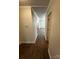 Hallway with wood-look flooring leading into a room with natural light at 801 Calhoun St, Lancaster, SC 29720