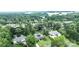 Aerial view of a home with a brick exterior, solar panels, a gazebo, and a lush backyard at 8259 Camelia Ln, Denver, NC 28037
