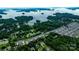 Aerial view of a lake community, showcasing waterfront homes and lush greenery in a serene setting at 8259 Camelia Ln, Denver, NC 28037
