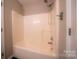 Bathroom features a tiled shower and grab bars at 8259 Camelia Ln, Denver, NC 28037