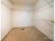 Walk-in closet with carpet flooring and wire shelving offering storage at 8259 Camelia Ln, Denver, NC 28037
