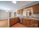 Well-lit kitchen featuring oak cabinets, neutral countertops, and stainless steel appliances at 8259 Camelia Ln, Denver, NC 28037