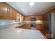 Modern kitchen features a clean design, updated stainless steel appliances and wood cabinets at 8259 Camelia Ln, Denver, NC 28037