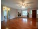 Bright living room with hardwood floors, fireplace, and windows at 8259 Camelia Ln, Denver, NC 28037
