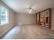 Spacious living room with luxury vinyl flooring and built-in shelving at 8259 Camelia Ln, Denver, NC 28037
