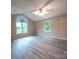 Spacious main bedroom with vaulted ceiling, ceiling fan and large windows for natural light at 8259 Camelia Ln, Denver, NC 28037