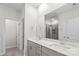 This bathroom features dual sinks, a shower, and a large mirror for a spacious and functional design at 9009 Myrna Dr, Gastonia, NC 28056