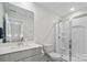 This full bathroom is equipped with a shower, gray vanity, modern faucet, and toilet at 9009 Myrna Dr, Gastonia, NC 28056
