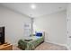 Bedroom with a single bed, carpet flooring, neutral walls, and minimal furnishings at 9009 Myrna Dr, Gastonia, NC 28056