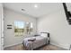 Bedroom with two windows, carpet floors, a single bed, and light walls at 9009 Myrna Dr, Gastonia, NC 28056