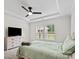 Bedroom featuring a ceiling fan, two windows, neutral walls, and carpet flooring at 9009 Myrna Dr, Gastonia, NC 28056
