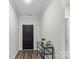 Inviting home foyer with an elegant console table, offering a glimpse of the home's interior at 9009 Myrna Dr, Gastonia, NC 28056