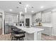 Modern kitchen with stainless appliances, a center island with barstool seating, and sleek gray cabinets at 9009 Myrna Dr, Gastonia, NC 28056
