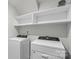 Laundry room with washer, dryer, and upper cabinets at 9009 Myrna Dr, Gastonia, NC 28056