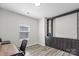 Home office with built-in shelving, natural light, and modern desk at 9009 Myrna Dr, Gastonia, NC 28056