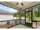 A screened porch offers a bug-free outdoor retreat with views of the backyard and surrounding greenery at 9009 Myrna Dr, Gastonia, NC 28056