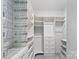 This custom walk-in closet is efficiently organized with shelves, drawers, and wire baskets for optimal storage at 9009 Myrna Dr, Gastonia, NC 28056