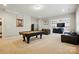 Finished basement with a pool table and seating area at 9511 Spurwig Ct, Charlotte, NC 28278