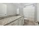 Bright bathroom with white cabinetry and granite countertops at 9511 Spurwig Ct, Charlotte, NC 28278