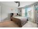 Bedroom with a ceiling fan, bed, and bright windows at 9511 Spurwig Ct, Charlotte, NC 28278