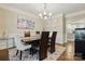 Elegant dining room featuring a modern chandelier and ample seating at 9511 Spurwig Ct, Charlotte, NC 28278