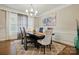 Elegant dining room with a chandelier, a large window, and a decorative rug at 9511 Spurwig Ct, Charlotte, NC 28278