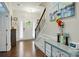 Bright foyer with hardwood floors, elegant lighting, and staircase at 9511 Spurwig Ct, Charlotte, NC 28278
