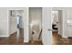 Hallway with hardwood floors and access to the stairs at 9511 Spurwig Ct, Charlotte, NC 28278