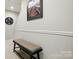 Hallway with a bench seat and a framed photo on the wall at 9511 Spurwig Ct, Charlotte, NC 28278