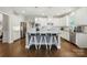 Stylish kitchen island with seating and stainless steel appliances at 9511 Spurwig Ct, Charlotte, NC 28278