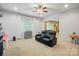 Bright living room with neutral colors, modern furniture, and natural light at 9511 Spurwig Ct, Charlotte, NC 28278