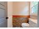 Classic bathroom with wainscoting, toilet, wood trim and ample natural light at 1010 Fallston Rd, Shelby, NC 28150
