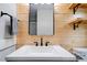 Bathroom sink with black hardware, white countertop, and wooden walls at 1010 Fallston Rd, Shelby, NC 28150