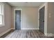 Bedroom with hardwood floors, neutral walls, white trim, and doors at 1010 Fallston Rd, Shelby, NC 28150