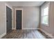 Comfortable bedroom with vinyl floors, window and stylish doors at 1010 Fallston Rd, Shelby, NC 28150