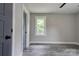 Neutral bedroom featuring hardwood floors, natural light and stylish door at 1010 Fallston Rd, Shelby, NC 28150