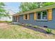 Charming home with a brick exterior, orange door, and well-maintained landscaping at 1010 Fallston Rd, Shelby, NC 28150