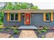 Charming home with a brick exterior, orange door, and well-maintained landscaping at 1010 Fallston Rd, Shelby, NC 28150