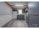 Modern kitchen featuring gray cabinetry, granite countertops, and white subway tile backsplash at 1010 Fallston Rd, Shelby, NC 28150