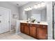 Bathroom features a double sink vanity, large mirror with vanity lighting, and neutral color scheme at 10198 Tintinhull Dr, Fort Mill, SC 29707